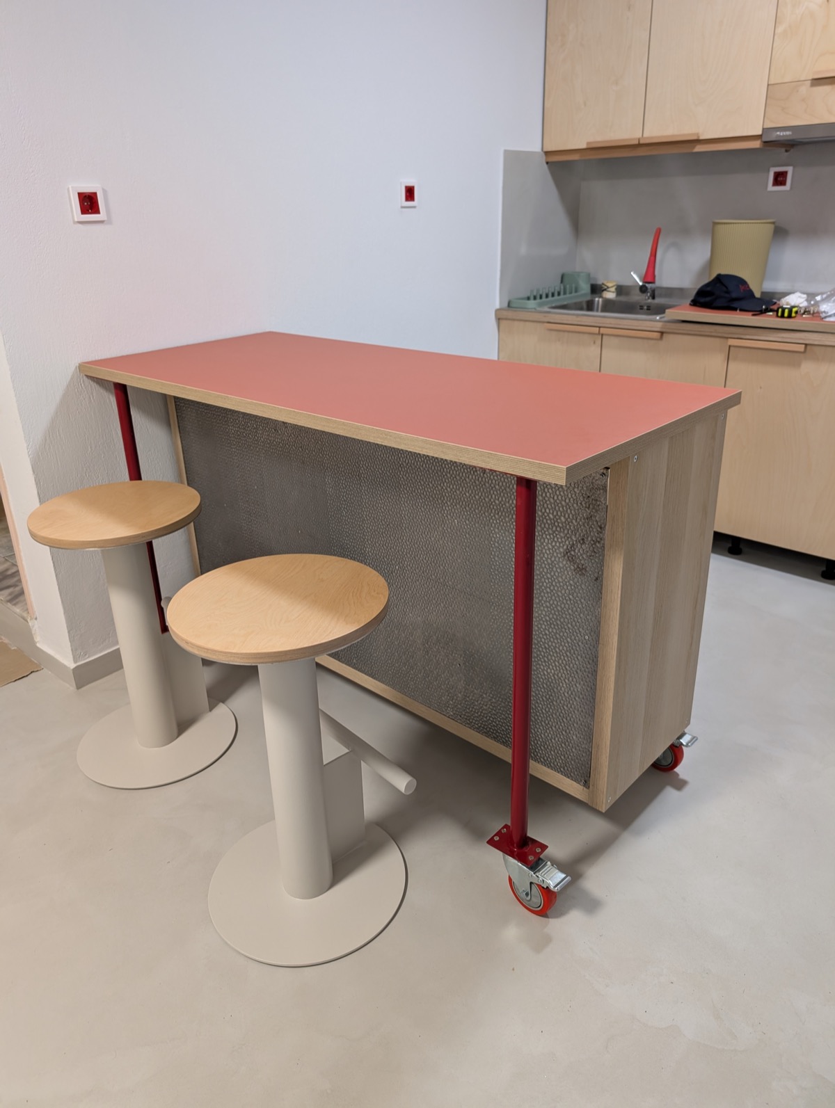 Two of the four finished stools in use at a kitchen breakfast bar