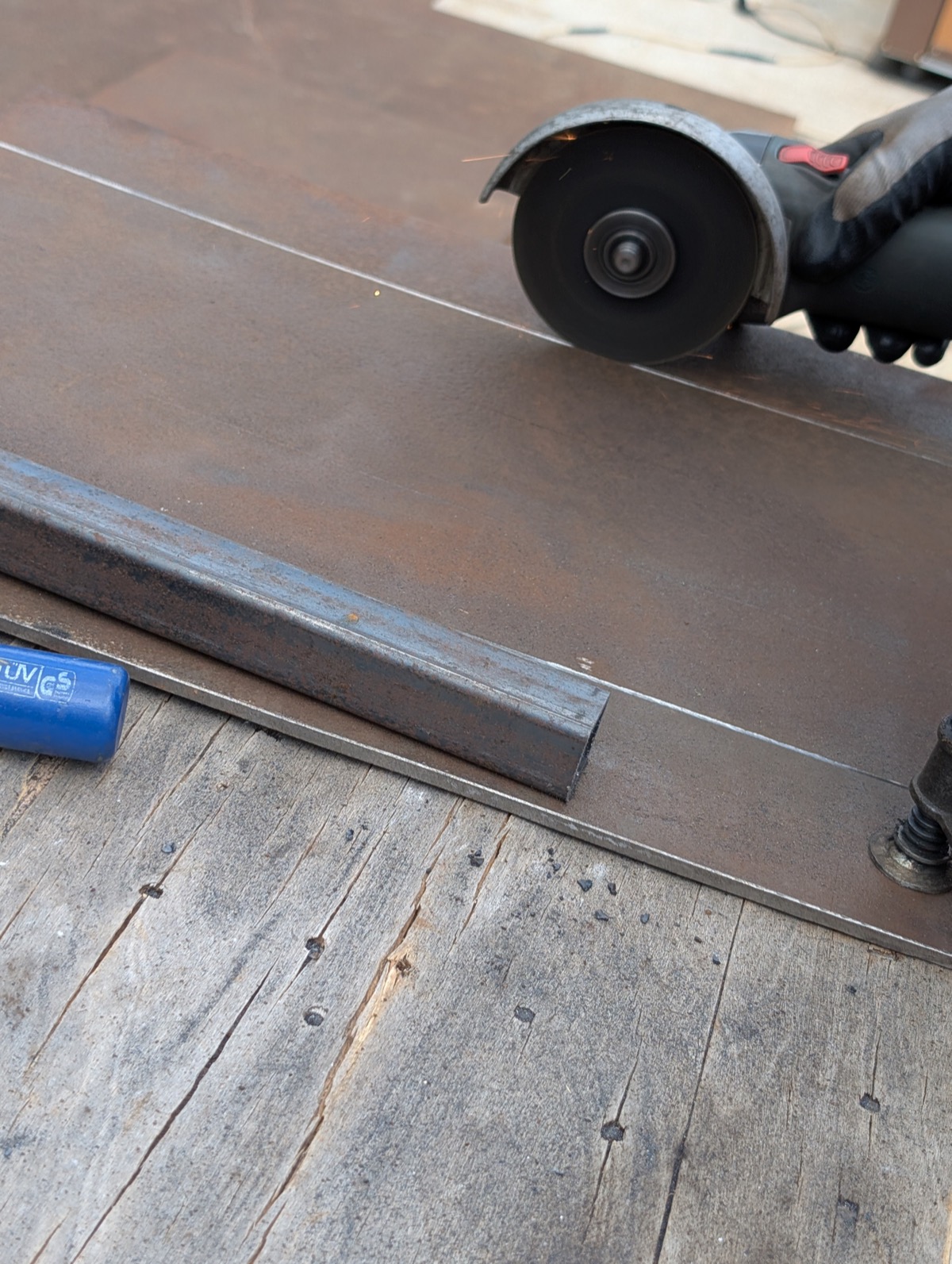 A steel plate with the first cuts marked and started