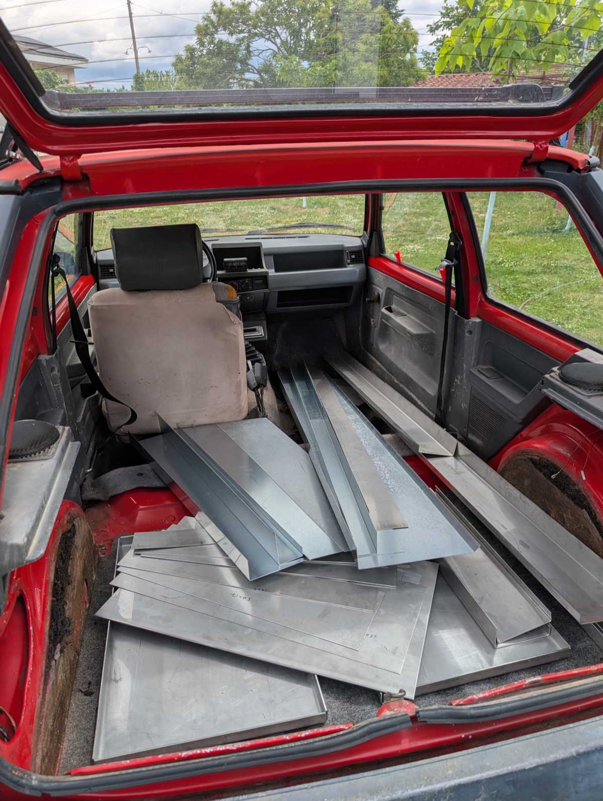 Stainless steel plates and formed profiles loaded in the back of a car