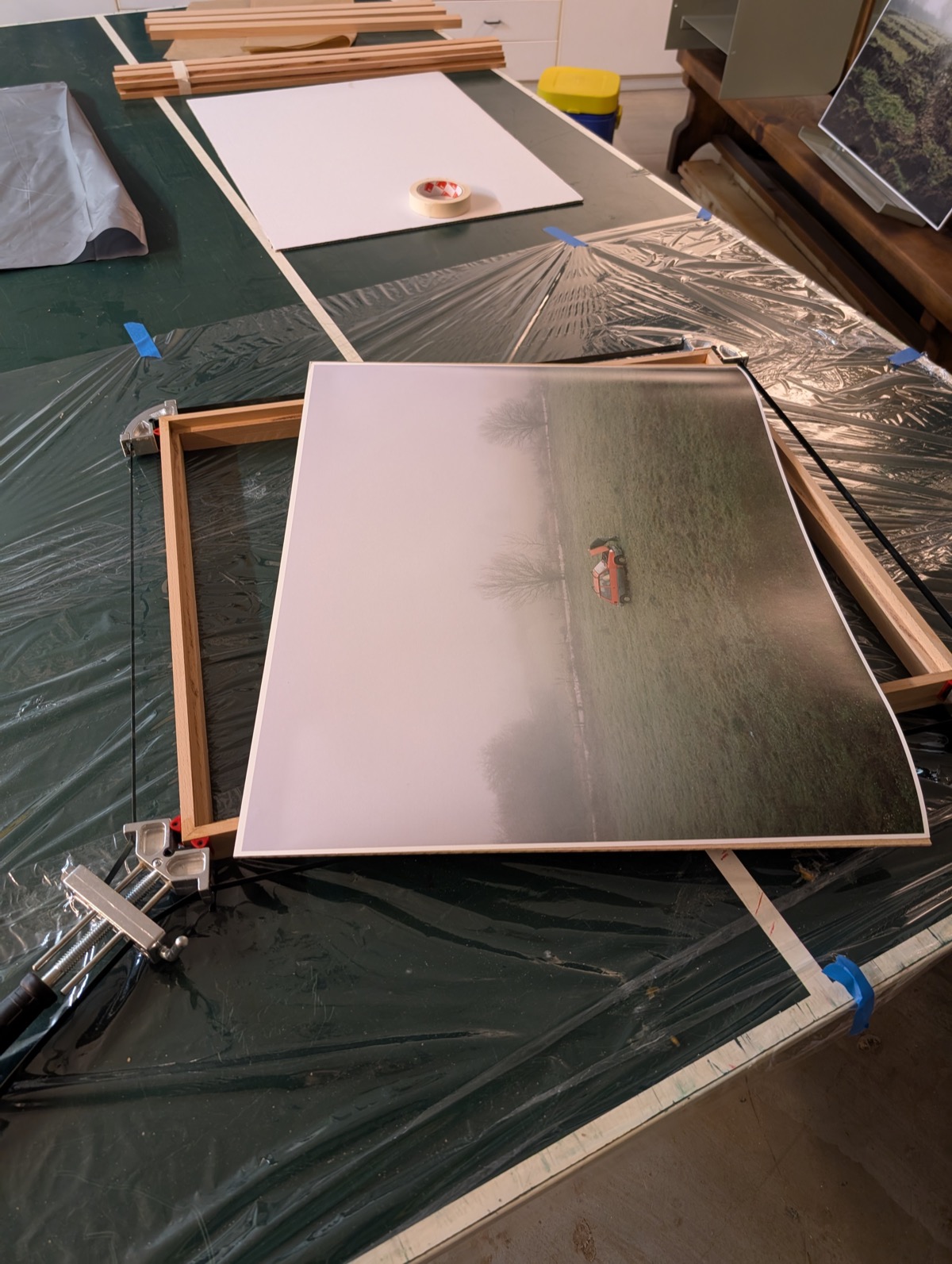 The print laid over the frame with a corner clamp, ready for assembly